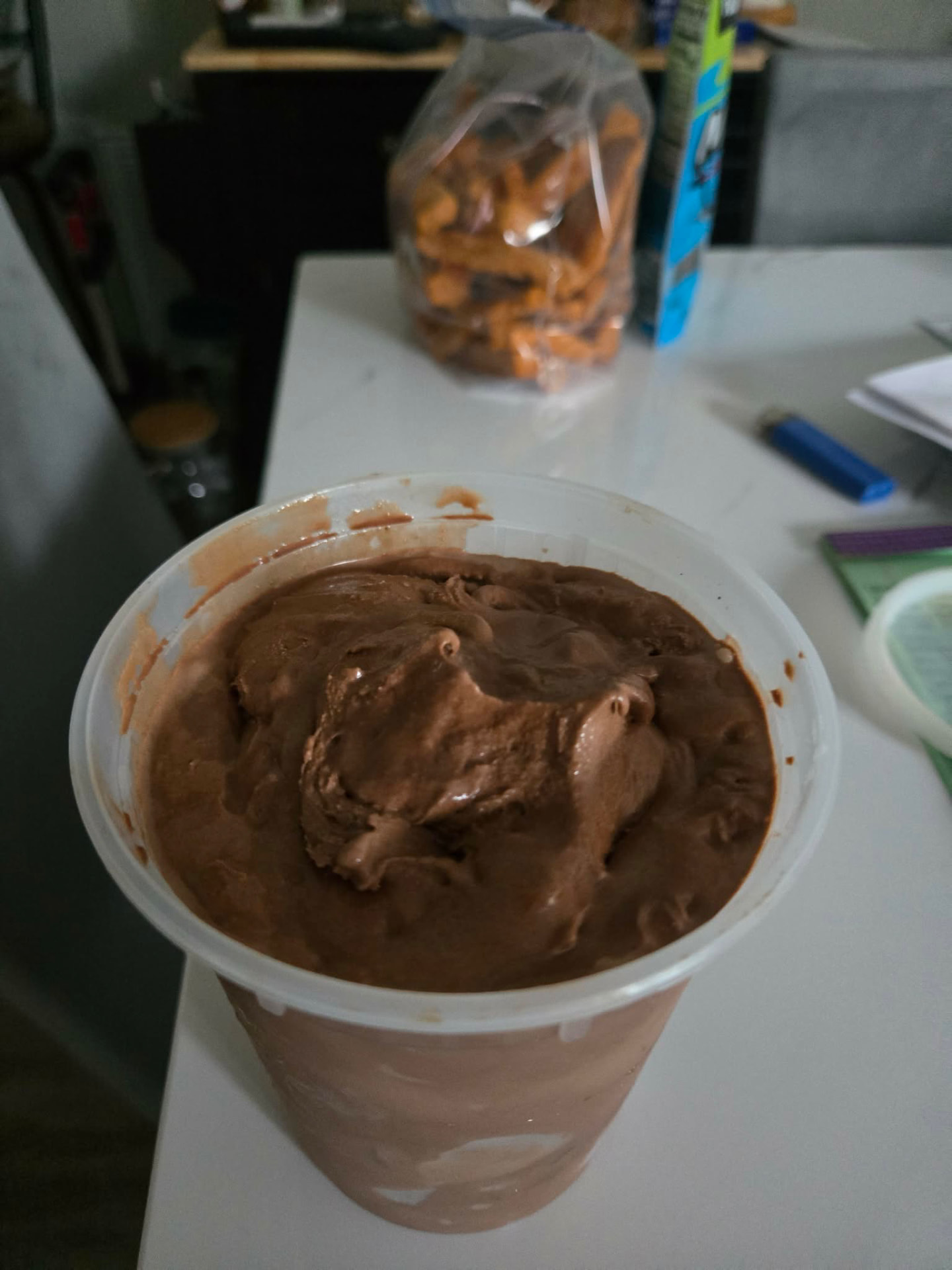 Tub of freshly churned chocolate ice cream